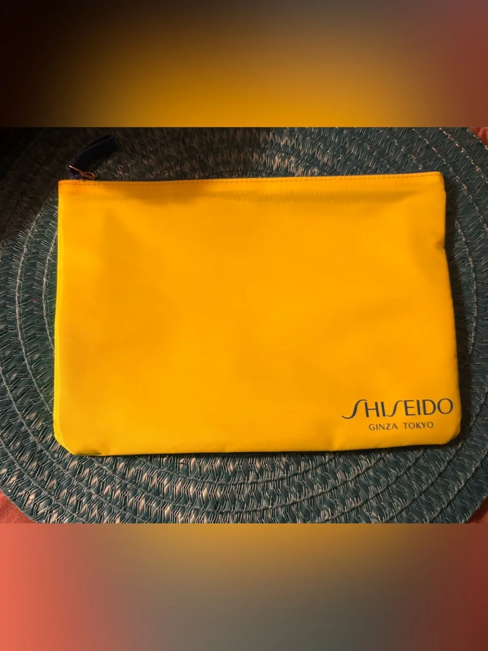 Shiseido make up bag neon yellow with blue zipper . 7” height 10” wide.